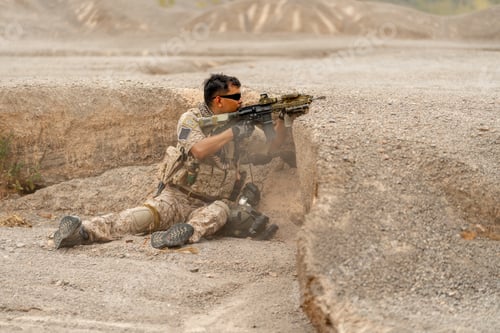 Preview: Military or soldier sit behind mound also hold gun and point to enemy in area of practice