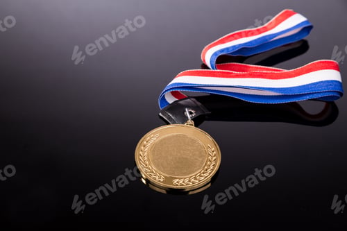 Preview: Generic sporting event gold medal with red and blue ribbon