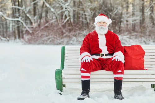 Preview: Santa Claus Sitting On Bench in Park