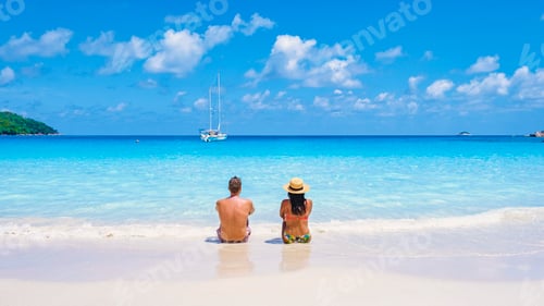 Preview: Praslin Seychelles tropical island with withe beaches and palm trees, couple men and women mid age