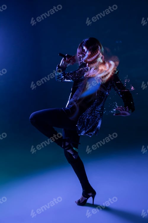 Preview: Stylish woman singing on stage