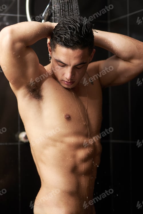Preview: Shredded in the shower. Shot of a handsome young man having a refreshing shower at home.