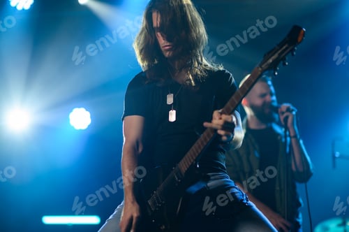 Preview: Guitarist performing live on stage with passion and energy