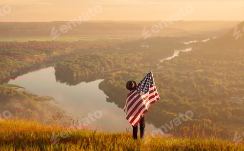 Preview: Man with USA flag in nature