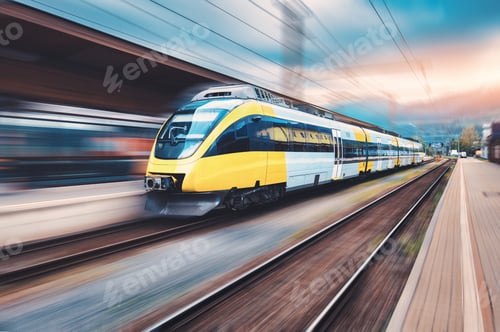 Preview: High speed yellow train in motion on the railway station
