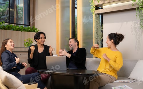 Preview: Group of business people discussing business plan at meeting table in office.