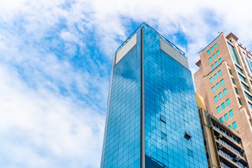 Preview: HONG KONG, CHINA - January, 2021 : Golden tall buildings and glass reflections in Hong Kong Island