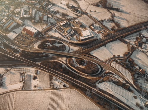 Preview: aerial view of highroad and rooftops at winter morning, Germany