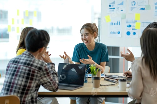 Preview: Happy Team Discussing Business Strategy in Bright Office