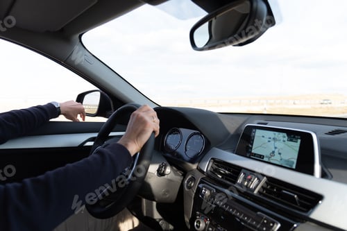 Preview: Side view of man driving