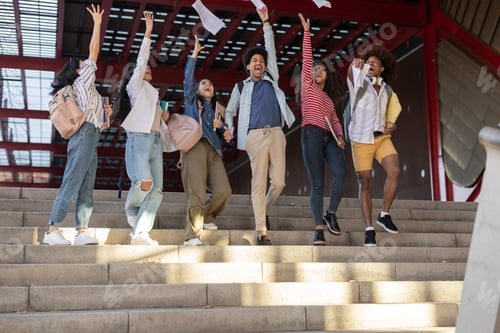Preview: Group of multiracial students throw up college notes finishing the academic year