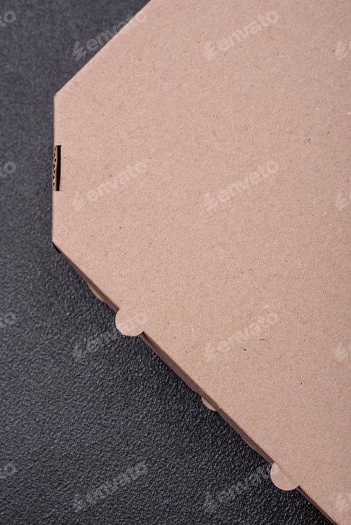 Preview: Empty cardboard rectangular brown box for delivery of delicious pizza