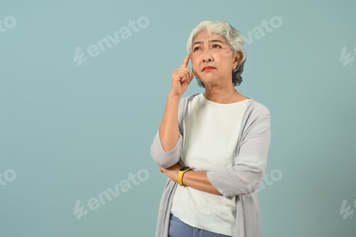Preview: Confused and thoughtful senior woman thinking and looking up expressing doubt.