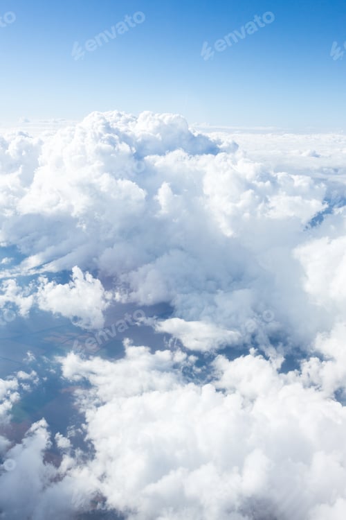 Preview: Clouds drift above a serene landscape during a clear day with blue skies and peaceful surroundings