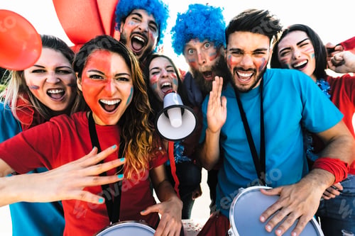 Preview: Football fans watching soccer match event at stadium