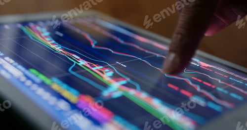 Preview: Stock market data on tablet computer at night