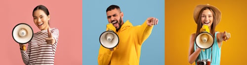 Preview: Cheerful multiethnic people shouting in megaphone and pointing at camera
