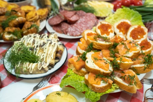 Preview: A lot of different food on the Banquet table.A large number of prepared dishes on the table.Holiday