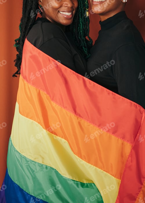 Preview: Happy lesbian couple with a colorful flag