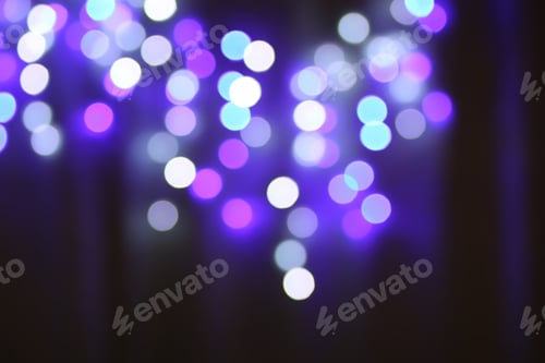 Preview: Abstract bokeh background. Blurred garland lights.