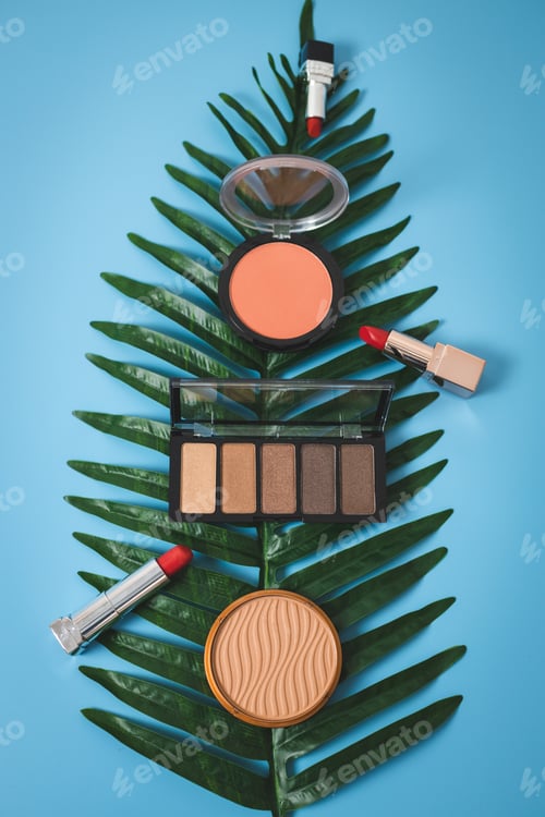 Preview: A set of female cosmetics on a blue background.