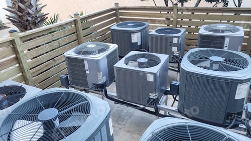 Preview: Air conditioners raised platforms at beach serviced by HVAC technicians .