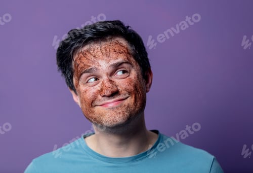 Preview: smiling guy in a face care mask