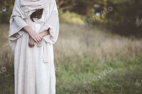 Preview: Closeup shot of a female wearing a biblical robe with a burred background