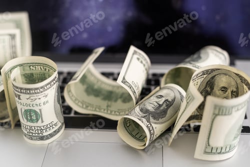 Preview: Money on computer keyboard. roll