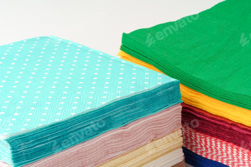 Preview: Two stacks of colorful paper napkins on white background