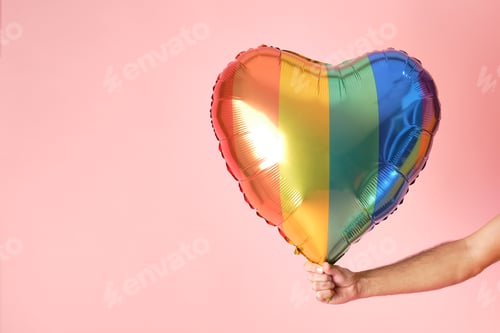 Preview: hand with balloon with gay pride colors