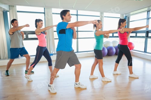 Preview: Full Length Of Sporty People Doing Power Fitness Exercise At Yoga Class