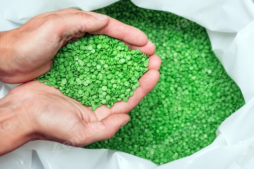 Preview: hands hold or touching biodegradable plastic pellets, plastic polymer granules