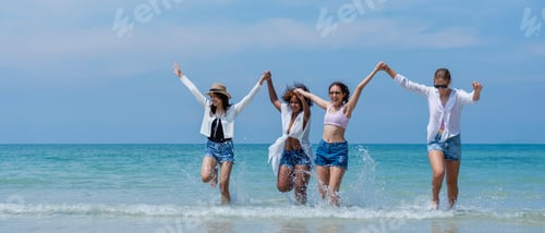 Preview: Happy children laughing and enjoying at beach. Teenage playing with friends at the sea.