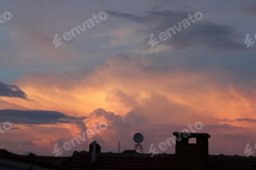 Preview: rooftop and stunning sunset in the background