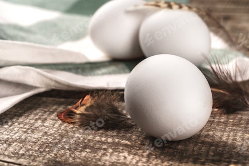 Preview: Close up of fresh chicken egg on nature wooden table