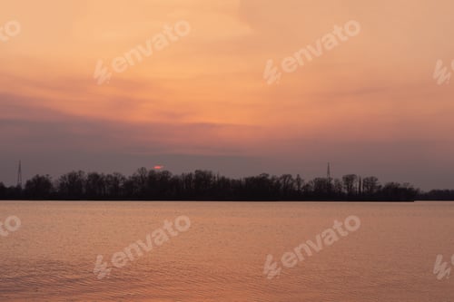 Preview: Evening sunset on a river. Early spring landscape.