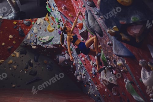 Preview: Female climber. Extreme indoor climbing.