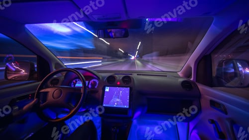 Preview: The man drive a car with a gps in the city. Evening night time. Wide angle