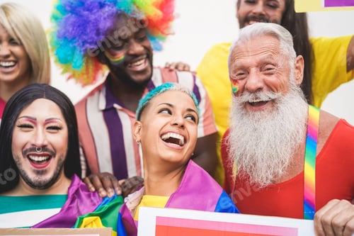 Preview: Group of people with rainbow flags and banners during Gay Pride event