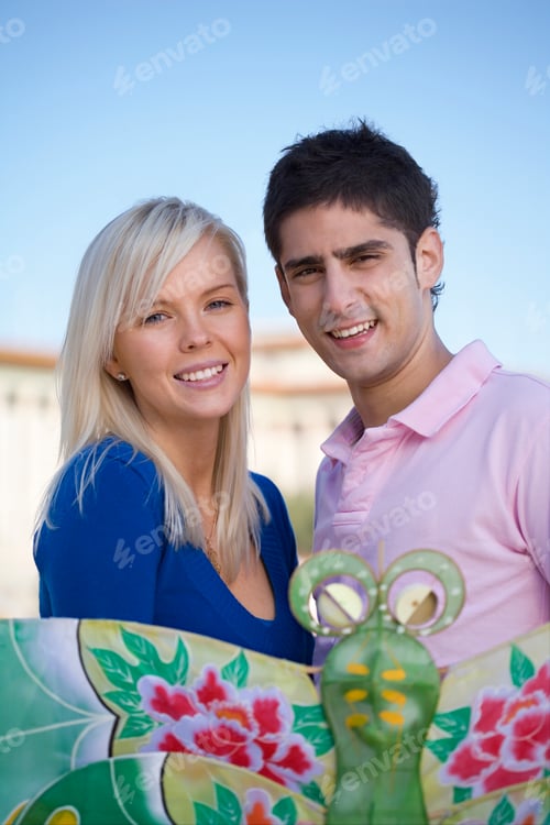 Preview: Young couple fly a traditional Chinese paper kite, Tiananmen Square, Beijing, China
