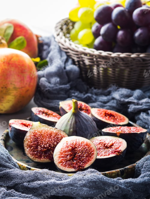 Preview: Dish of purple figs, grapes and pomegranate
