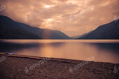 Preview: Sun Going Down over a Lake ion a Cloudy Day