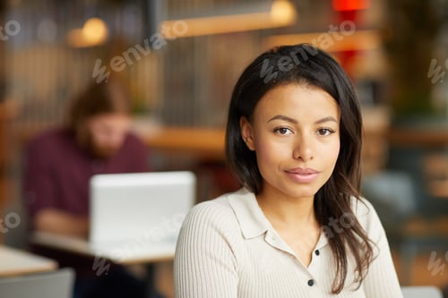 Preview: Beautiful young woman in cafe