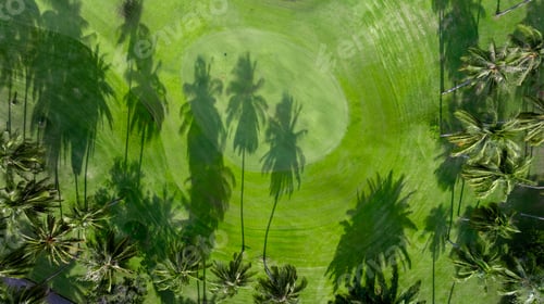 Preview: Aerial top view golf course with lush greens, green fairway and sand bunker, Golf course