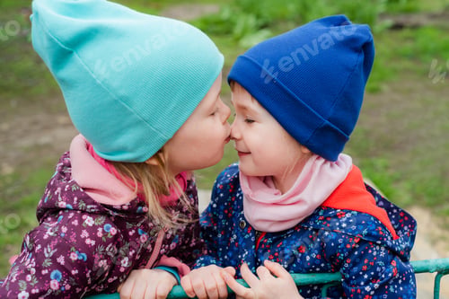Preview: One girl kisses another on the nose. The sisters love and support each other.