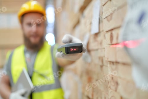 Preview: Worker scanning products with a barcode scanner