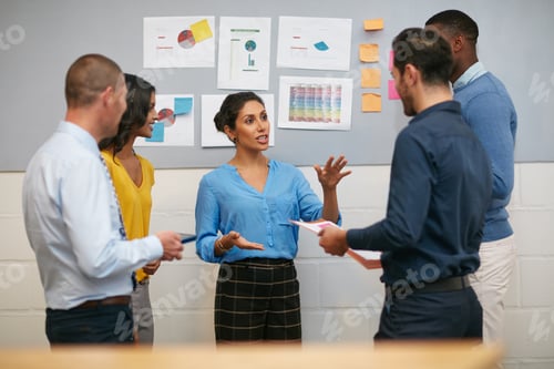 Preview: Cropped shot of a group of businesspeople talking in the office