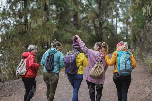 Preview: Group of multiracial women doing trekking day in the nature