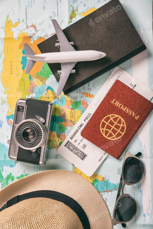 Preview: Travel and vacation accessories, map background. Vertical, top view.